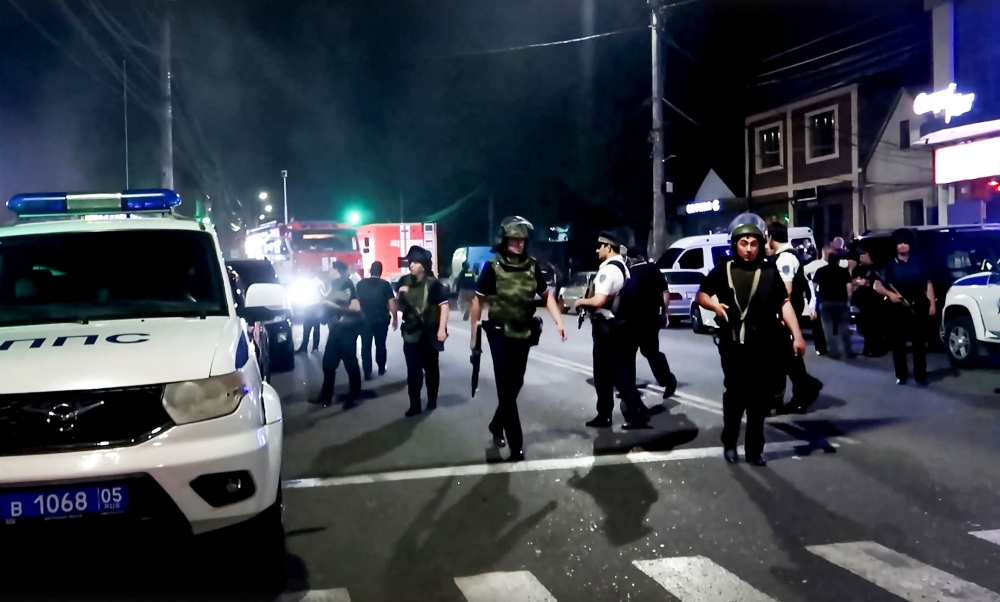 In this grab taken from a handout footage released by the National Antiterrorism Committee on June 24, 2024, Russia's FSB security service officers conduct an anti-terrorist operation in Dagestan. (Photo by Handout / Russia's National Antiterrorism Committee / AFP) 