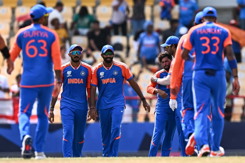 India players congratulate each other after defeating Australia during the ICC men's Twenty20 World Cup 2024 Super Eight cricket match between Australia and India at Daren Sammy National Cricket Stadium in Gros Islet, Saint Lucia on June 24, 2024. (Photo by Chandan Khanna / AFP)
