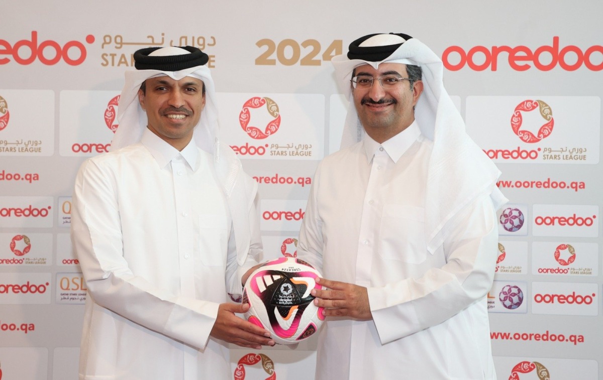 Qatar Football Association and QSL President Jassim bin Rashid Al Buenain and Ooredoo Qatar CEO Sheikh Ali bin Jabor Al Thani  hold the Conext 24, the official ball for the new Ooredoo Stars League season.