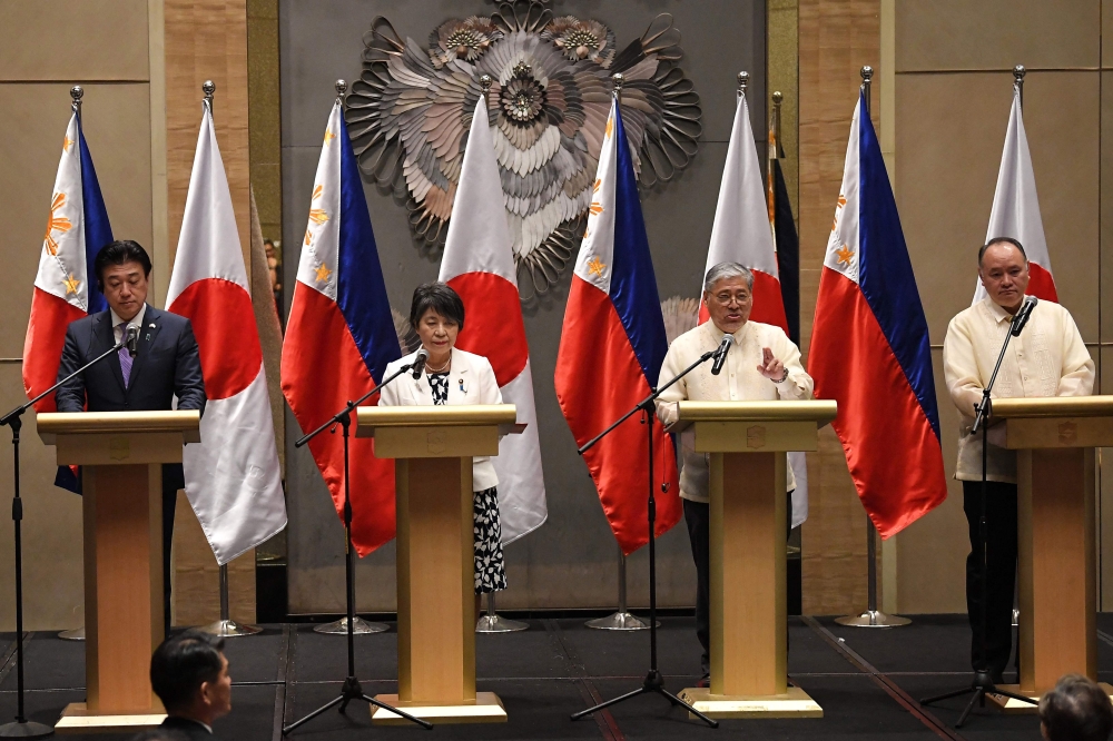 Philippines' Secretary of Foreign Affairs Enrique Manalo (2nd R) gestures as he answers a question while Japan's Defence Minister Minoru Kihara (L), Japan's Foreign Minister Yoko Kamikawa (2nd L) and Philippines' Secretary of Defence Gilberto Teodoro (R) listens during a joint press conference after their 2+2 meeting in Manila on July 8, 2024. (Photo by Ted Aljibe / AFP)