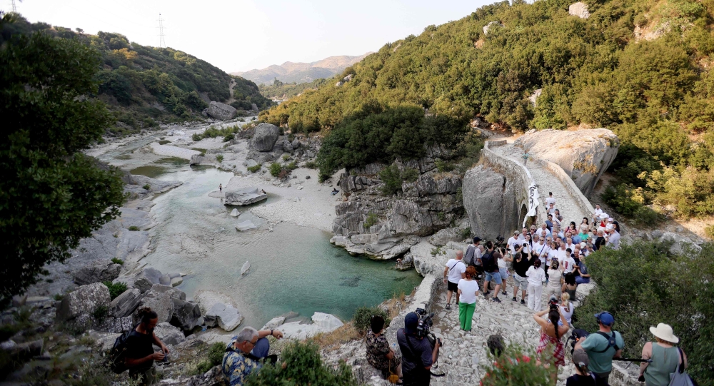 Local residents and environmentalists take part in a protest against the construction of a water pipeline, at Brataj old bridge over Shushica river, in the village of Brataj, near Albanian city of Vlore, some 200 km South of capital Tirana, on July 12, 2024. Photo by ADNAN BECI / AFP