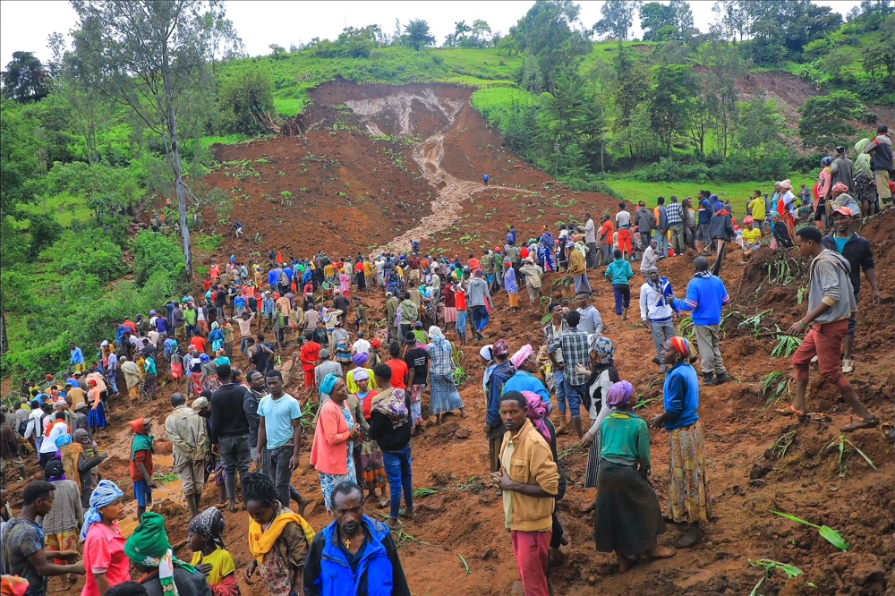 In this grab made from a handout footage released by the Gofa Zone Government Communication Affairs Department on July 22, 2024, shows people standing at the bottom of a landslide that occurred in the Geze-Gofa district. Photo by Gofa Zone Government Communication Affairs Department/ESN / AFP