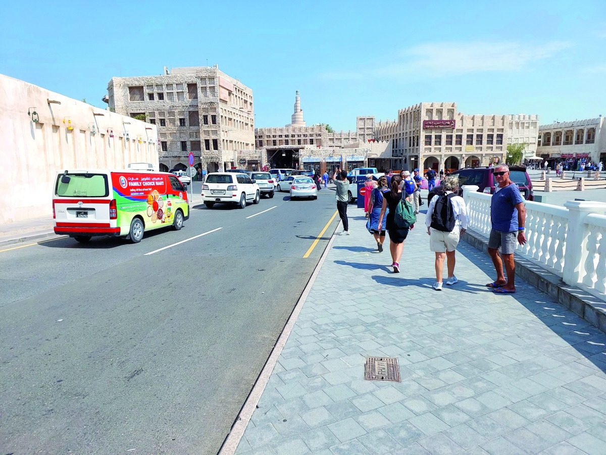 A file photo of tourists walking towards the markets at Souq Waqif.