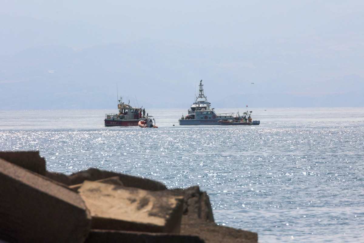 A Coast Guard boat and an Italian fireboat search for six others missing after recovering a victim due to a sailboat sank off the coast of Porticello, nosthwestern of Sicily Island, on August 19, 2024. Photo by Igor Petyx / ANSA / AFP.