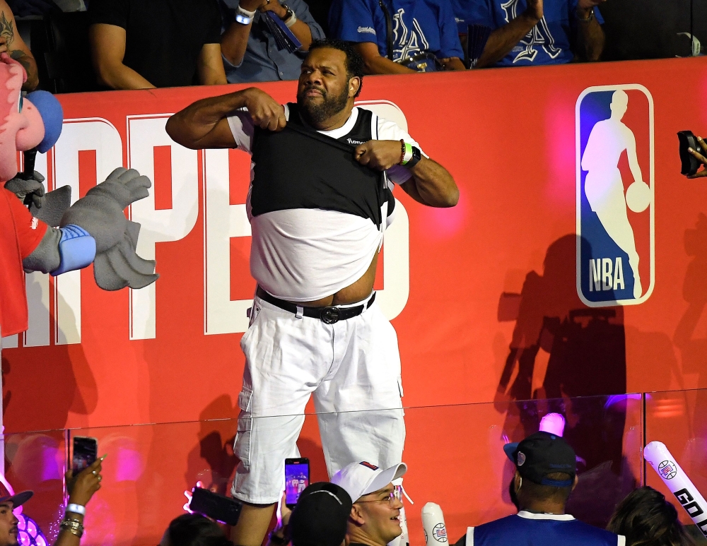 US Rapper Fatman Scoop performs during a time out in the second half in game four of the Western Conference Finals between the Phoenix Suns and the LA Clippers at Staples Center on June 26, 2021 in Los Angeles, California. (Photo by Kevork DJANSEZIAN / GETTY IMAGES NORTH AMERICA / AFP)
