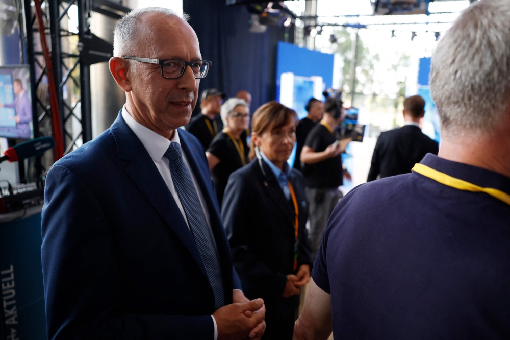 Joerg Urban (R) top candidate of the far-right Alternative for Germany (AfD) party for regional elections in Saxony looks on prior to an election TV debate at the State Parliament in Dresden, eastern Germany on September 1, 2024, after the closure of the polling stations. (Photo by Odd ANDERSEN / AFP)
