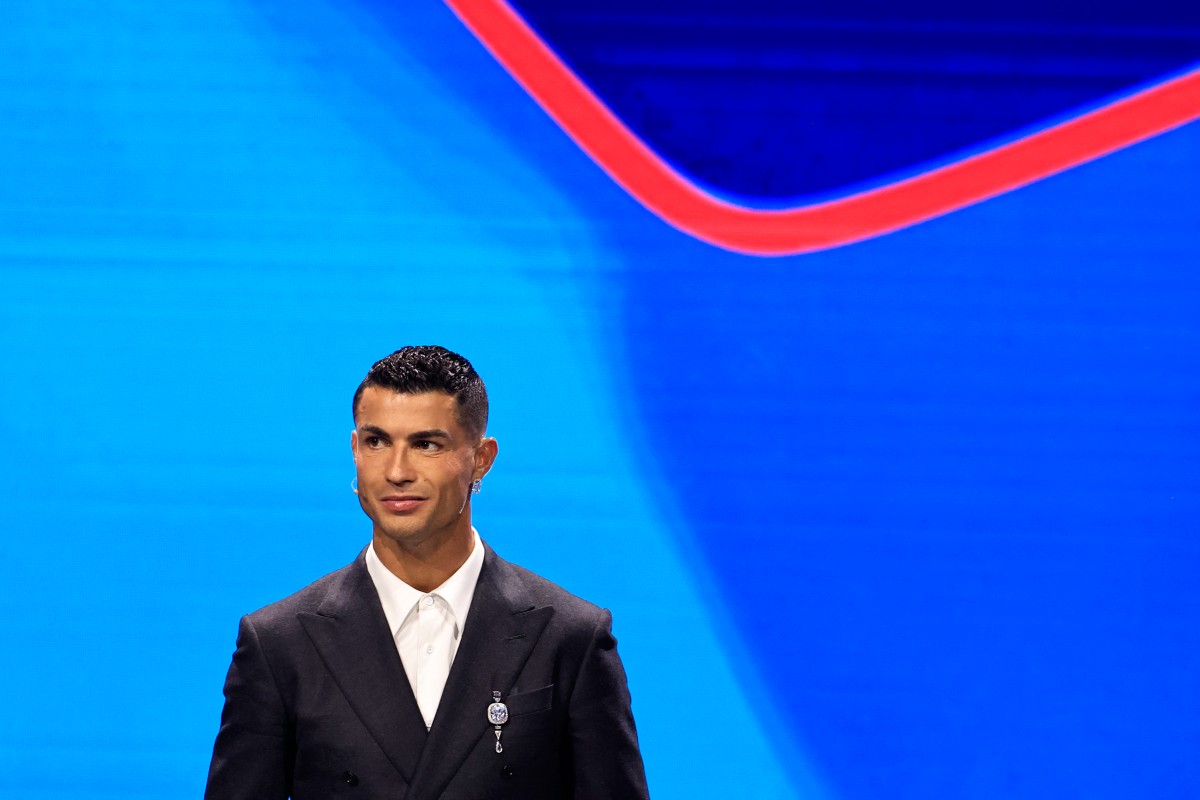 Portugal's national team player and Saudi Al-Nassr's forward Cristiano Ronaldo stands on stage during the ceremony of the draw for the group stage of the 2024-2025 UEFA Champions League football tournament, at the Grimaldi Forum in Monaco on August 29, 2024. Photo by Valery HACHE / AFP.