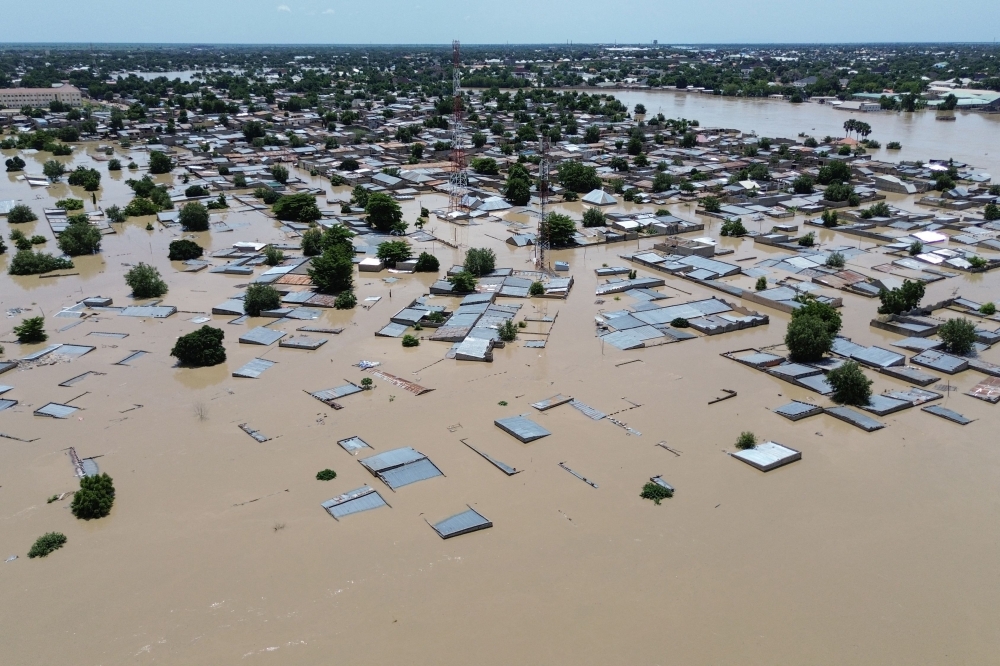 This aerial view shows houses submerged under water in Maiduguri on September 10, 2024. Photo by Audu MARTE / AFP