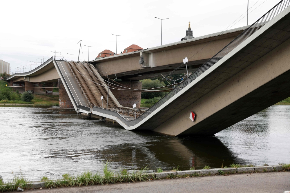 The partially collapsed Carola Bridge (Carolabruecke) on the Elbe river is pictured in the city centre of Dresden, Saxony, eastern Germany, on September 11, 2024. Photo by Odd ANDERSEN / AFP