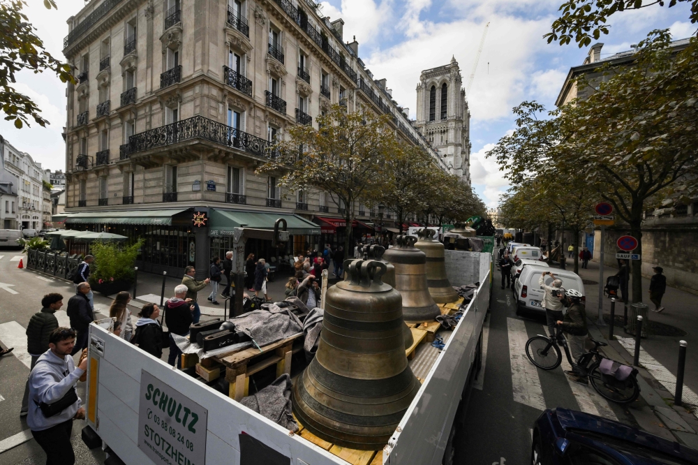 This photograph shows the arrival of the eight bells of the north belfry of Notre-Dame de Paris cathedral, central Paris on September 12, 2024. (Photo by Ed JONES / AFP)
 