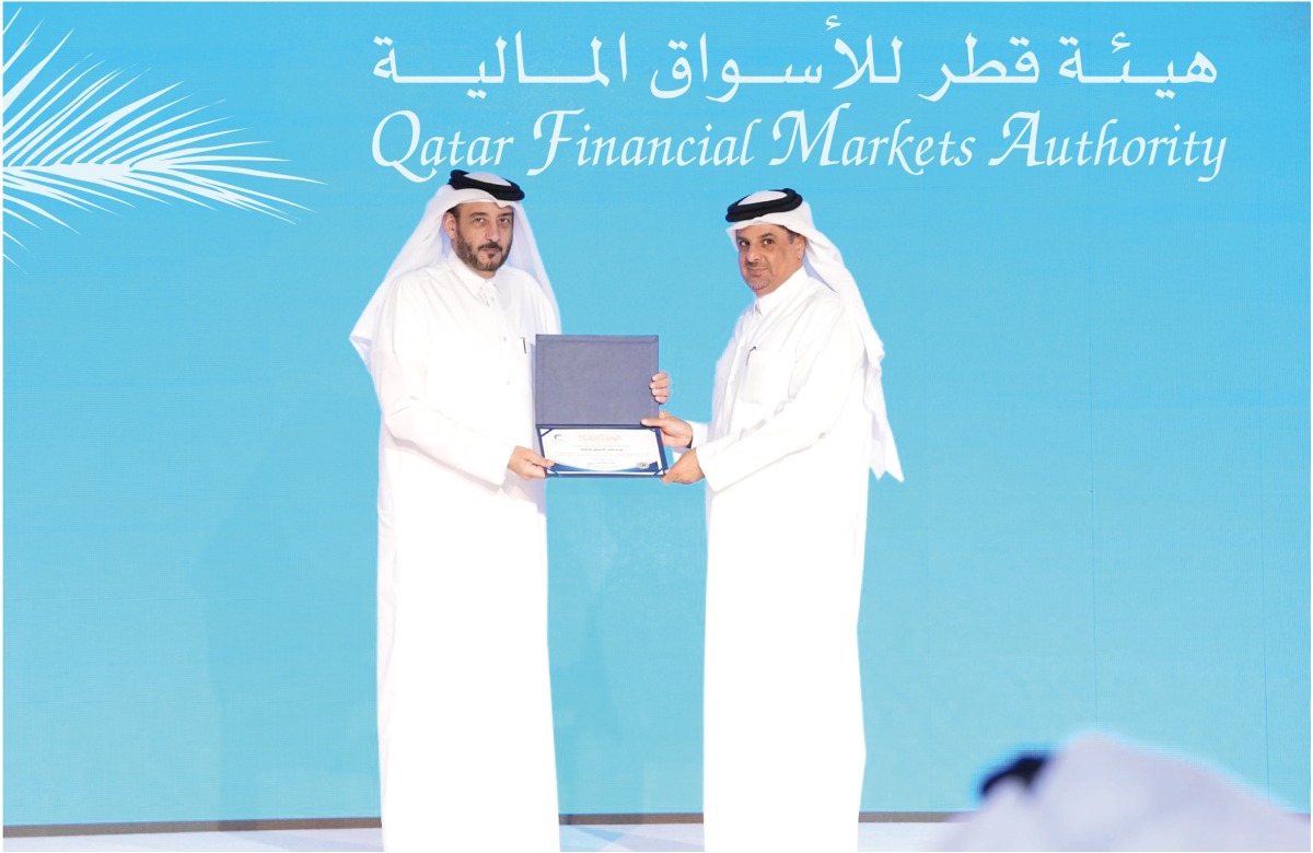 Eng. Abdulrahman Al Malki handed over the certificate to Ahmad Salem Sultan, Director of Public Relations & Communication Department at QFMA.