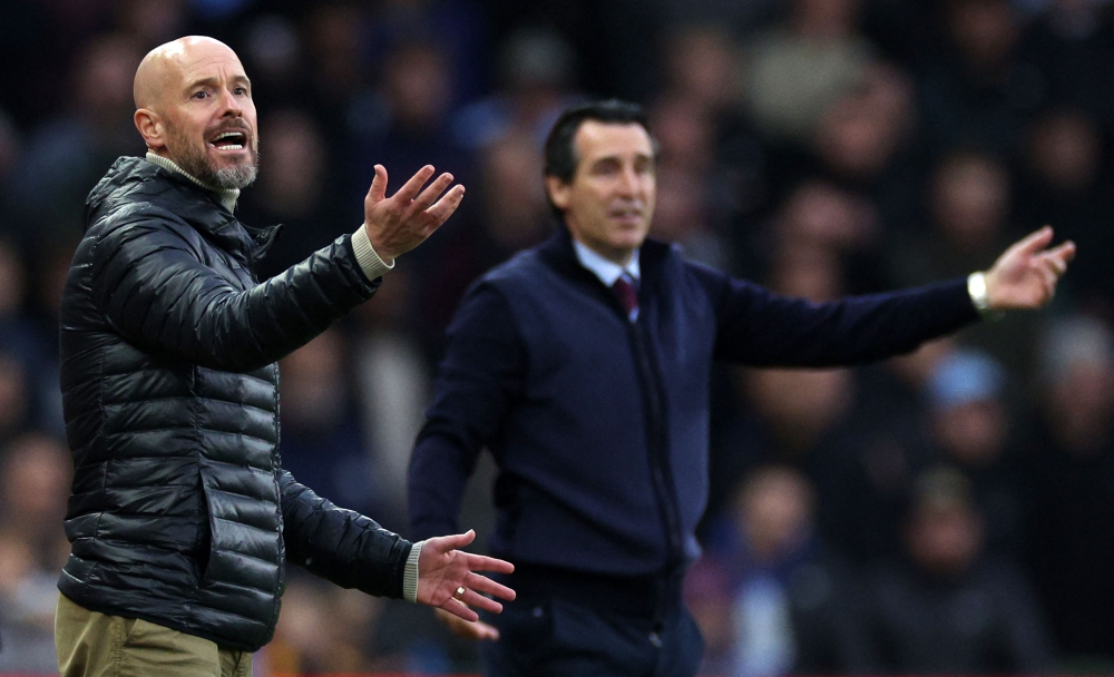 Manchester United's Dutch manager Erik ten Hag (L) and Aston Villa's Spanish head coach Unai Emery react during the English Premier League football match between Aston Villa and Manchester United at Villa Park in Birmingham, central England on October 6, 2024. (Photo by Adrian Dennis / AFP) 