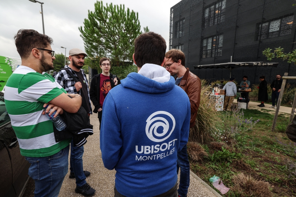 Some of the 470 employees at the video production company Ubisoft gather during a strike in Montpellier, southern France on October 15, 2024. (Photo by Pascal Guyot / AFP)