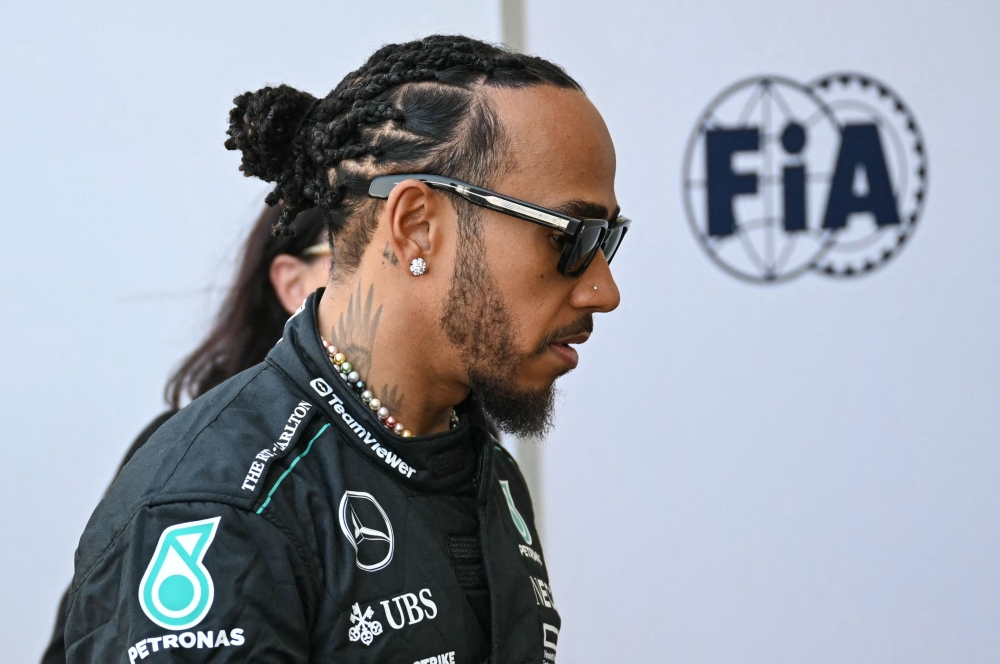 British driver Lewis Hamilton walks in the paddock ahead of the United States Formula One Grand Prix at the Circuit of the Americas in Austin, Texas, on October 17, 2024. (Photo by Patrick T. Fallon / AFP)