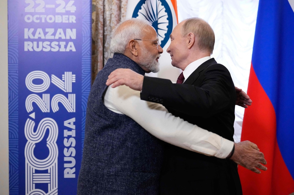Russia's President Vladimir Putin meets with Indian Prime Minister Narendra Modi on the sidelines of the BRICS summit in Kazan on October 22, 2024. (Photo by Alexander Zemlianichenko / POOL / AFP)