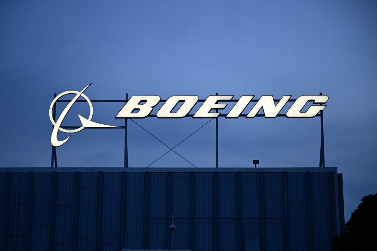 The Boeing Co. logo is displayed on top of company offices near Los Angeles International Airport (LAX) in El Segundo, California on January 18, 2024.  Photo by Patrick T. Fallon / AFP