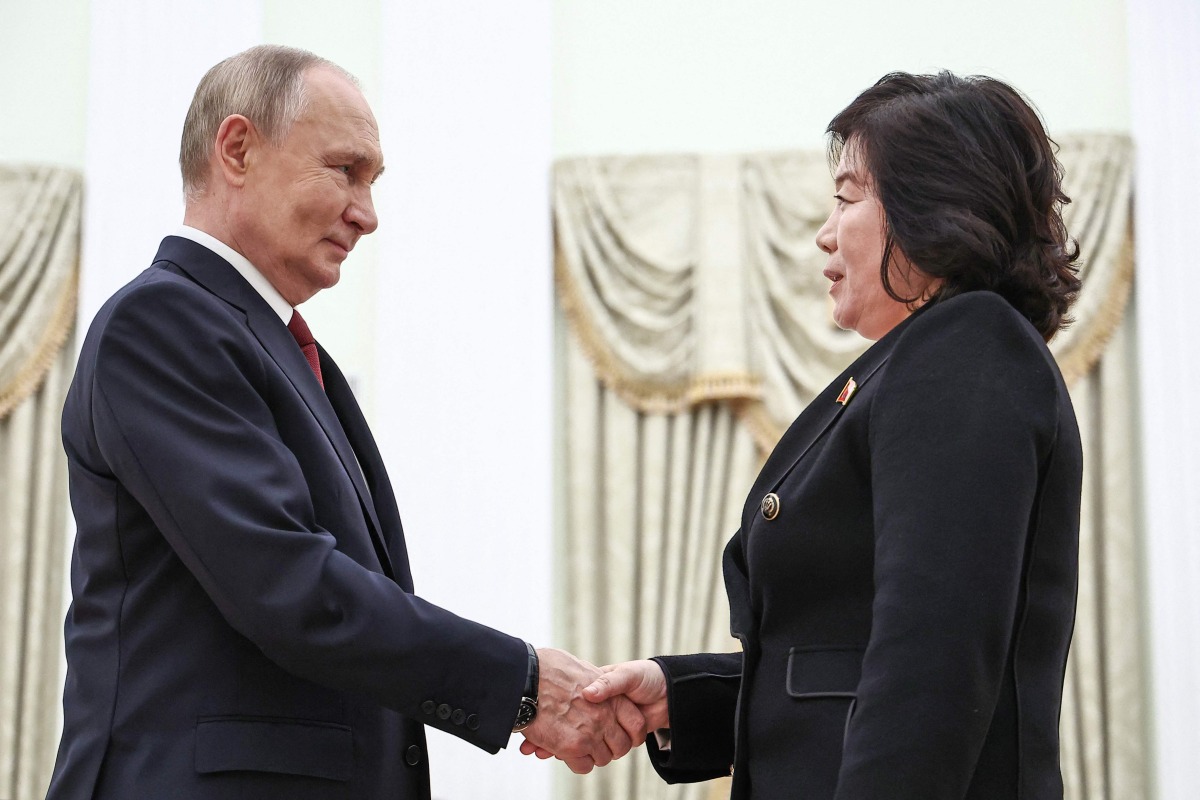 In this pool photograph distributed by Russian state agency Sputnik, Russia's President Vladimir Putin (L) greets North Korea's Foreign Minister Choe Son Hui (R) prior to their talks in Moscow on November 4, 2024. (Photo by Mikhail TERESHCHENKO / POOL / AFP)
