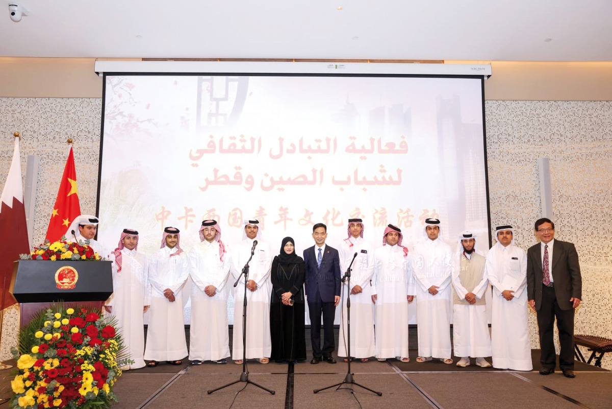 Ambassador of China to Qatar H E Cao Xiaolin (centre) along with officials and students at the event.