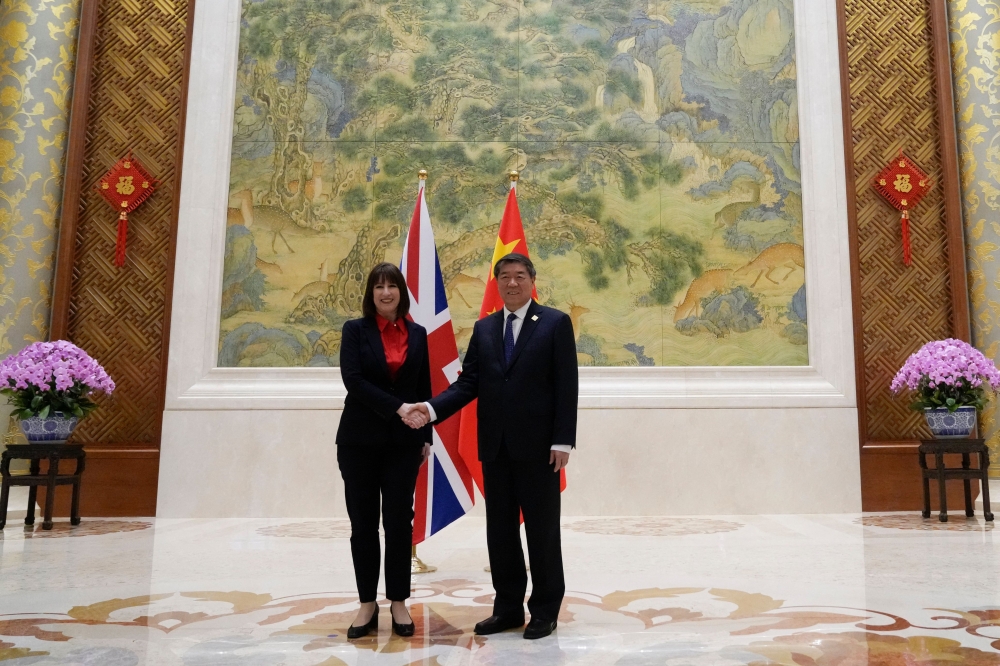 British Treasury chief Rachel Reeves (L) meets Chinese Vice Premier He Lifeng before the start of the Fourth China-UK Financial Services Summit in Beijing in Beijing on January 11, 2025. (Photo by Aaron Favila / Pool / AFP)