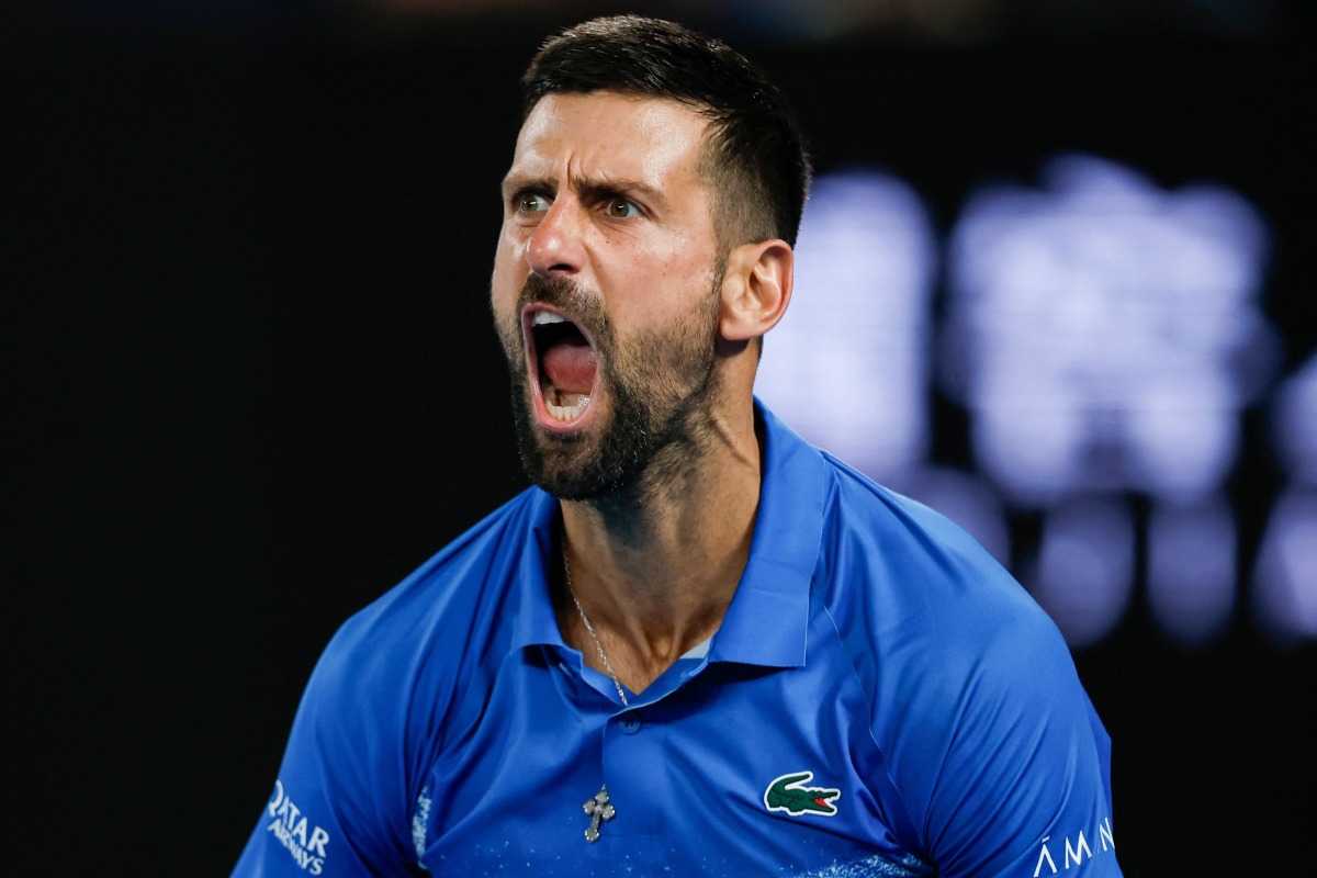 Serbia's Novak Djokovic reacts after a point against Czech Republic's Tomas Machac during their men's singles match on day six of the Australian Open tennis tournament in Melbourne on January 17, 2025. (Photo by Martin KEEP / AFP)