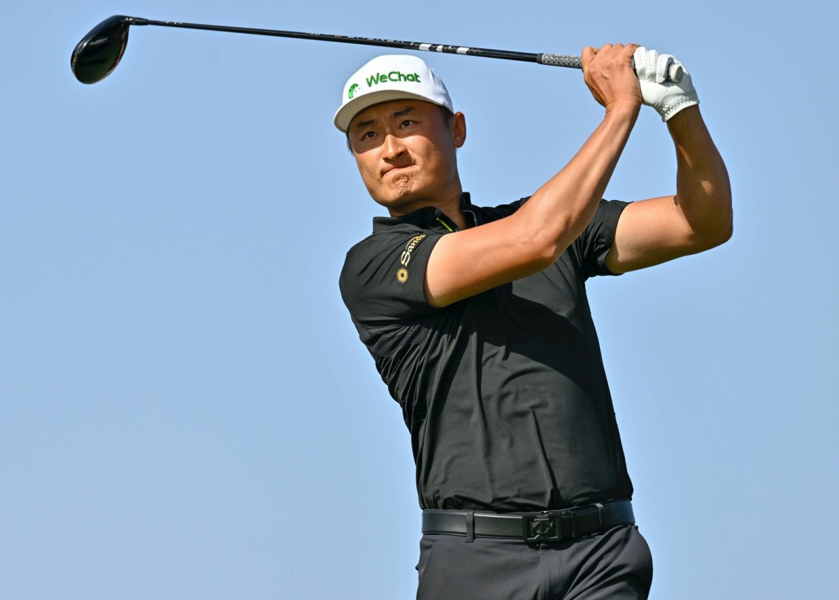Haotong Li of China tees off during the third round of the Commercial Bank Qatar Masters yesterday.