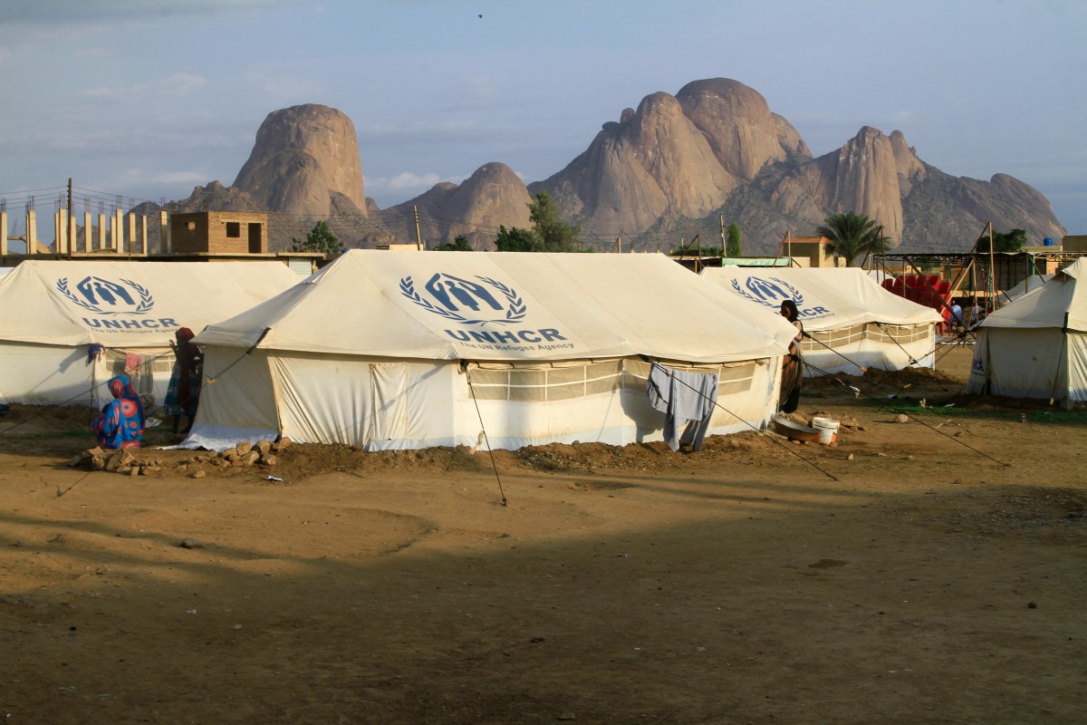 Representational file photo. People already displaced by conflict, rest by tents at a makeshift campsite they were evacuated to following deadly floods in the eastern city of Kassala on August 11, 2024. (Photo by AFP)

