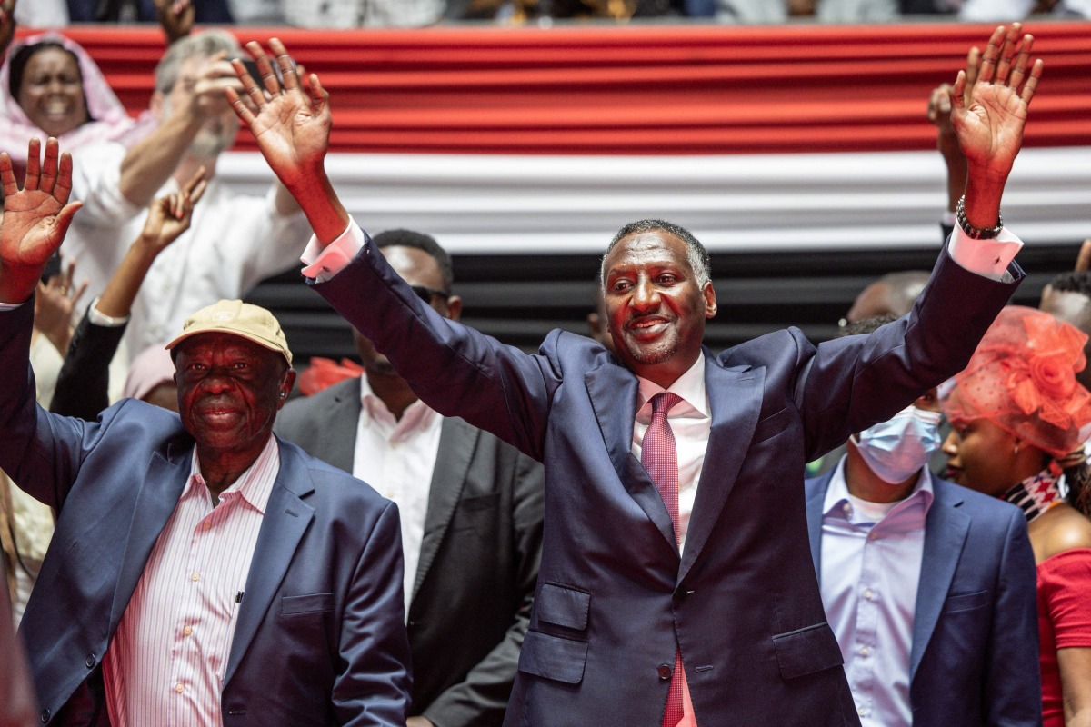 Abdul Rahim Hamdan Dagalo (R), Sudan's Rapid Support Forces deputy commander and brother to Mohamed Hamdan Dagalo (also known as Hemedti), flanked by chairperson of the Sudan People's Liberation Army (SPLA-North) Abdelaziz al-Hilu (L), arrive at the venue ahead of their planned signing of the Government of Peace and Unity Charter, at the Kenyatta International Convention Centre (KICC) in Nairobi on February 18, 2025. (Photo by SIMON MAINA / AFP)
