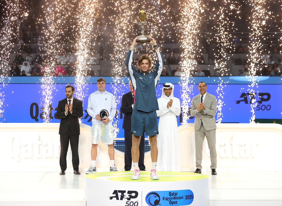 Russia's Andrey Rublev celebrates with the trophy after winning the Qatar ExxonMobil Open title yesterday.