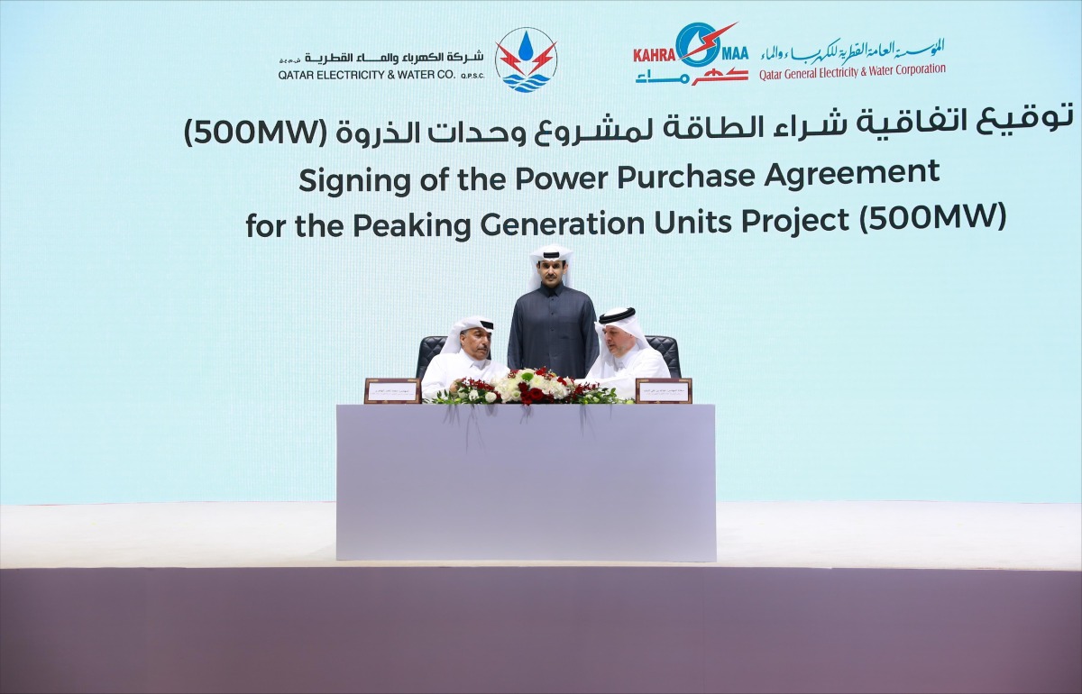 Minister of State for Energy Affairs H E Saad Sherida Al Kaabi witnessing an agreement signed by President of Kahramaa H E Eng Abdulla bin Ali Al Theyab, and Managing Director and CEO of QEWC Eng Mohammed Nasser Al Hajri.