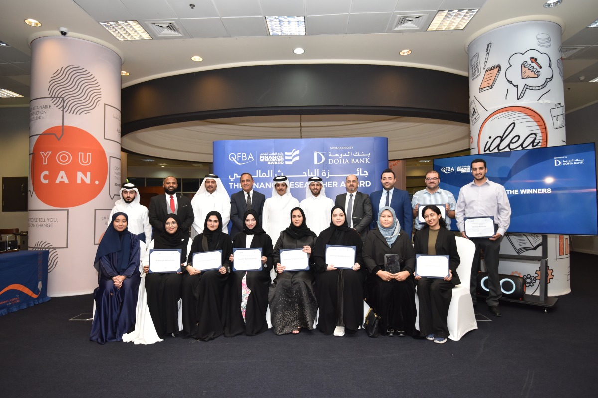 Officials pose for a group photo with winners of the first edition of the National Finance Researcher Award ceremony.