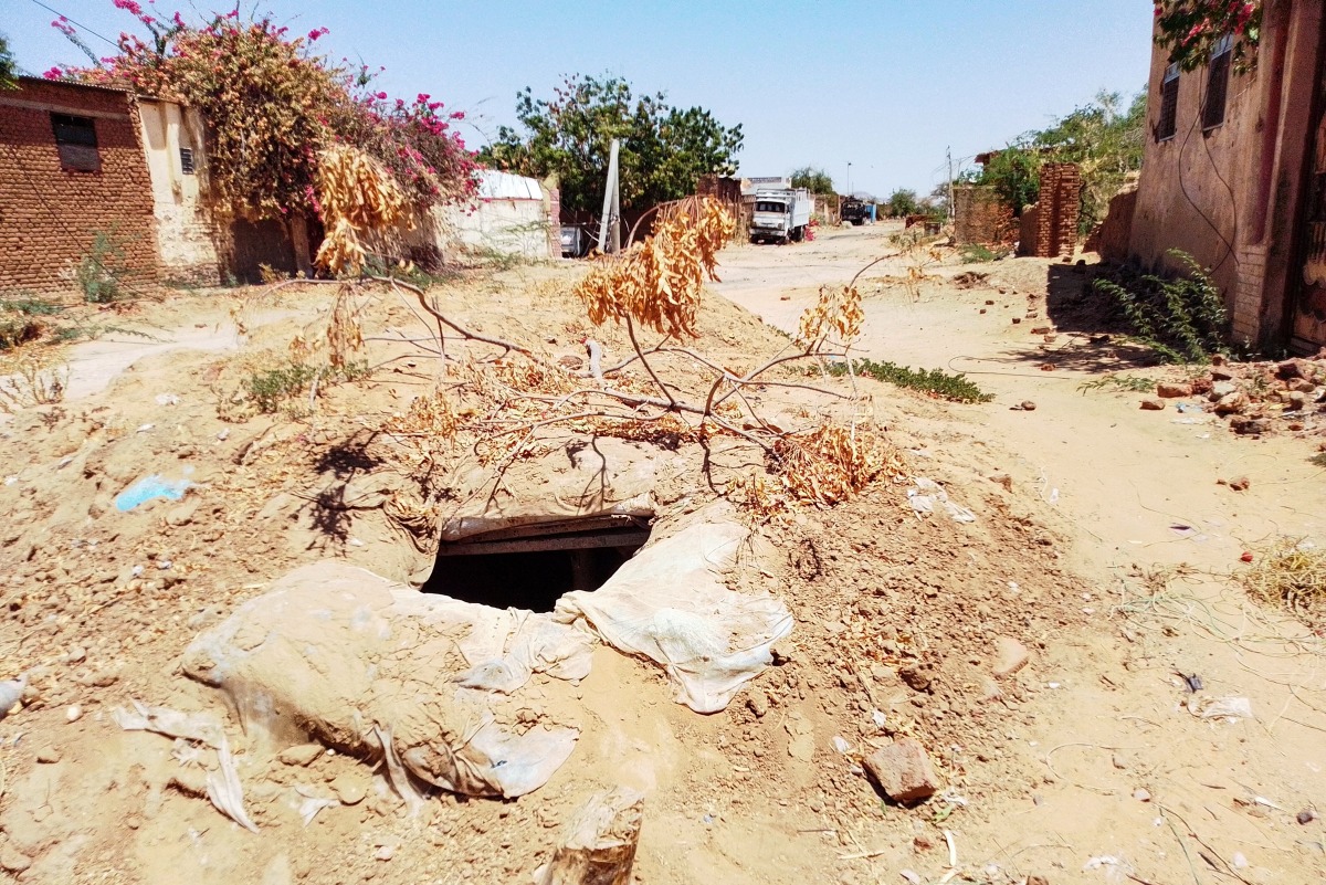 This picture taken on March 13, 2025, shows a makeshift bunker dug by civilians in North Darfur state capital El-Fasher, as a hideout from clashes between the paramilitary Rapid Support Forces (RSF) and the Sudanese army and allied militias. (Photo by Muammar Ibrahim / AFP)
