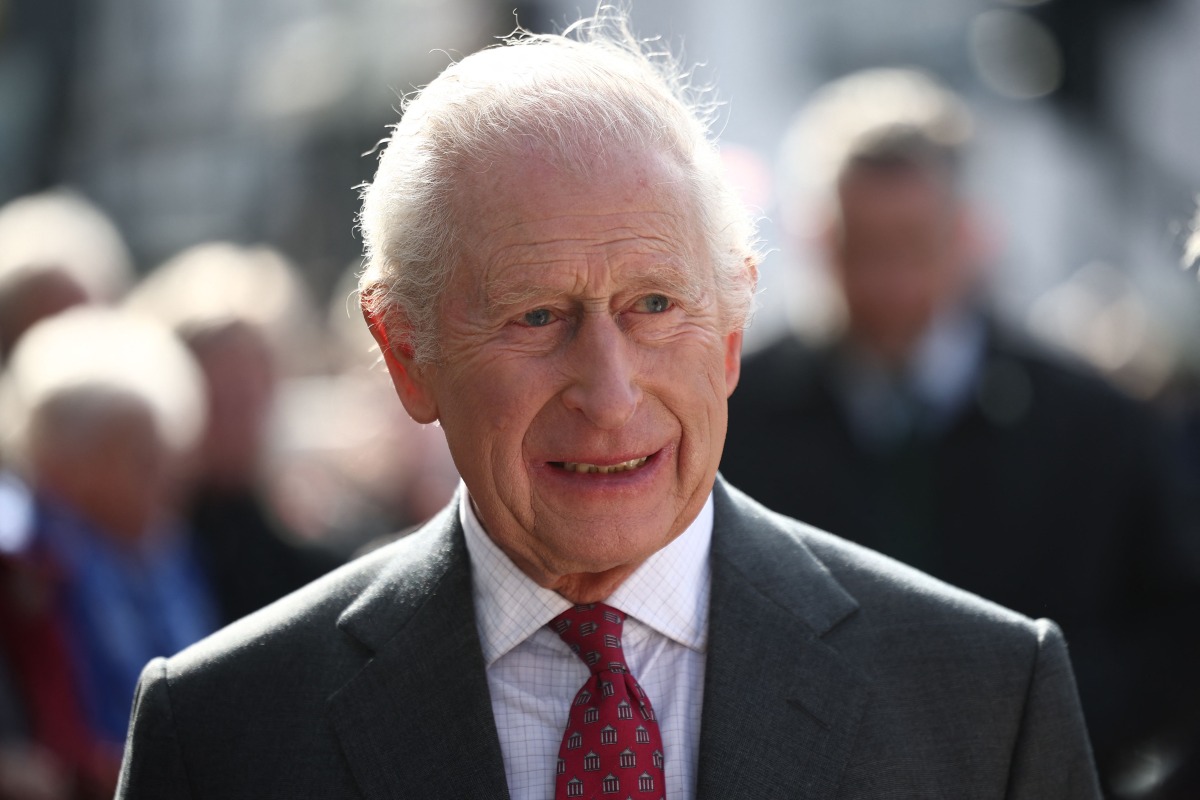 Britain's King Charles III meets well-wishers as he arrives with Britain's Queen Camilla to visit the Roe Valley Arts and Cultural Centre, in Limavady, on March 20, 2025, during a three-day trip to Northern Ireland. Photo by HENRY NICHOLLS / POOL / AFP