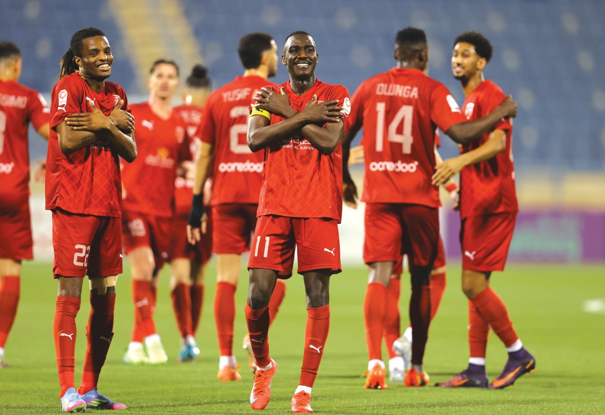 Al Duhail players celebrate their win over Al Gharafa. 