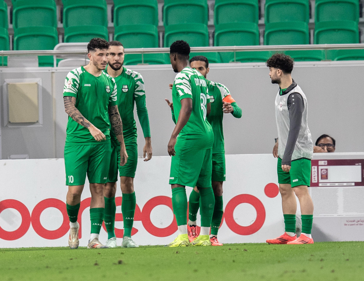 Al Ahli players celebrate their goal against Al Rayyan on Saturday.