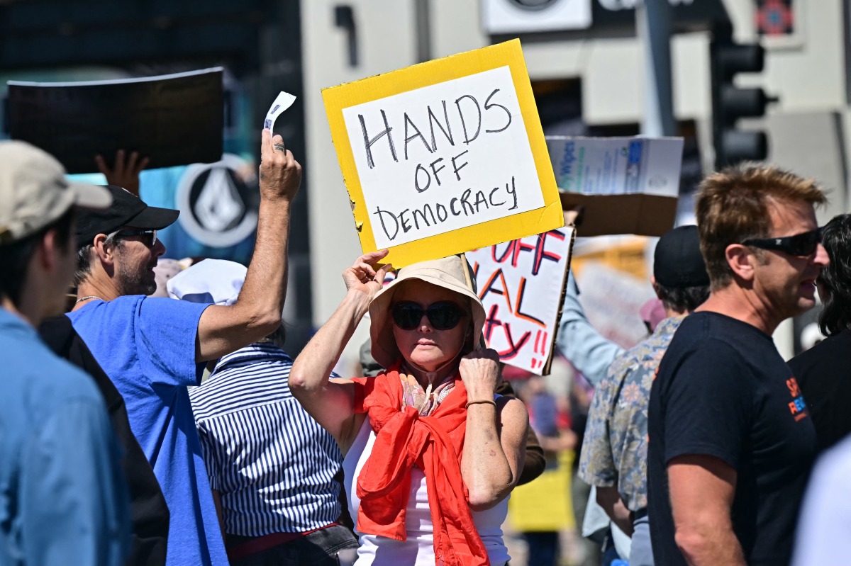 A protester holds a sign during a 