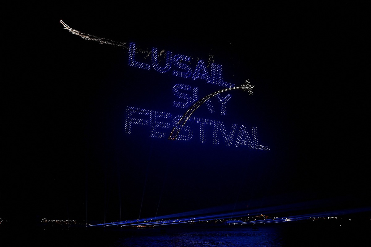 Drones perform a light show over Lusail City during the Lusail Sky Festival as part of Qatar's Eid al-Fitr celebrations on April 4, 2025. (Photo by Karim JAAFAR / AFP)