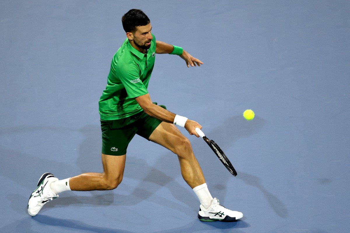 Novak Djokovic of Serbia returns a shot to Jakub Mensik of the Czech Republic during the men's singles final of the Miami Open Presented by Itau at Hard Rock Stadium on March 30, 2025 in Miami Gardens, Florida. Matthew Stockman/Getty Images/AFP