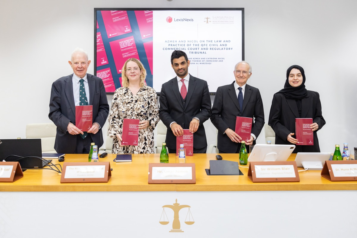 Officials pose for a group photo during the launch of legal guide on the QFC Court and Regulatory Tribunal, recently.