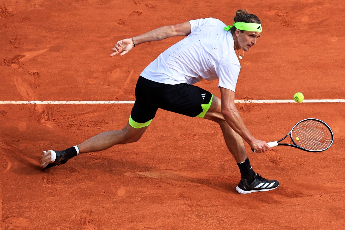 Germany's Alexander Zverev returns the ball to Italy's Matteo Berrettini during the Monte Carlo ATP Masters Series Tournament round of 32 tennis match on the Rainier III court at the Monte Carlo Country Club in Roquebrune-Cap-Martin on April 8, 2025. (Photo by Valery HACHE / AFP)