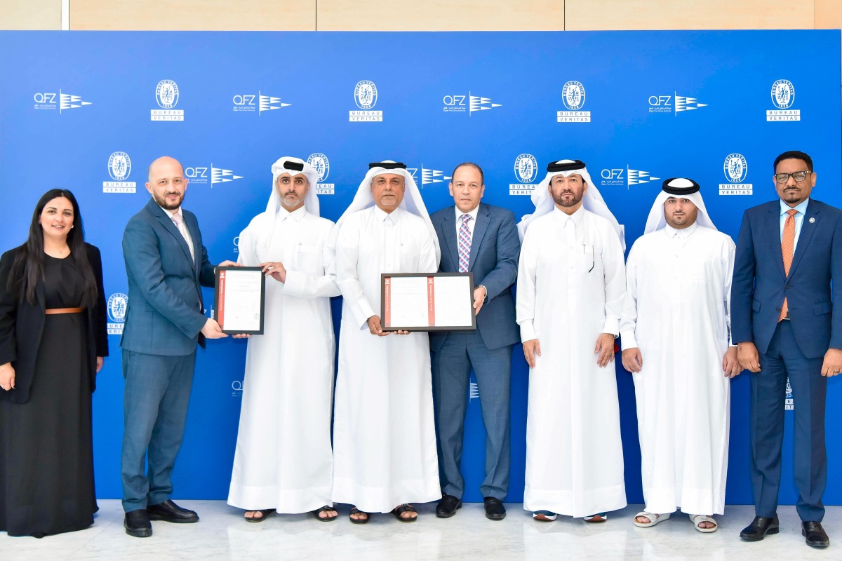 Chief Corporate Development and Business Excellence Officer at QFZ, Dr. Fahad Zainal with other officials receiving the ISO certifications. 