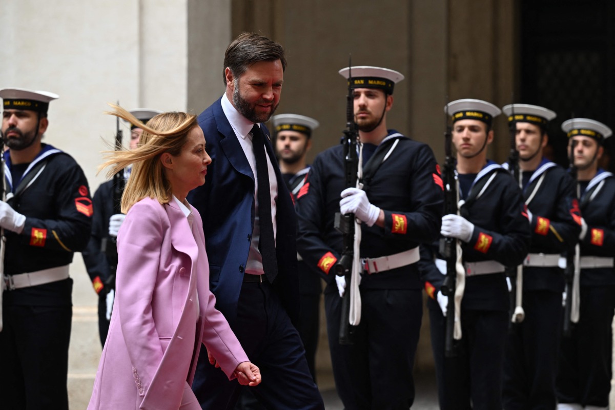 Italy's Prime Minister, Giorgia Meloni welcomes U.S. Vice President JD Vance at Palazzo Chigi prior their meeting in Rome on April 18, 2025. (Photo by Kenny HOLSTON / POOL / AFP)
