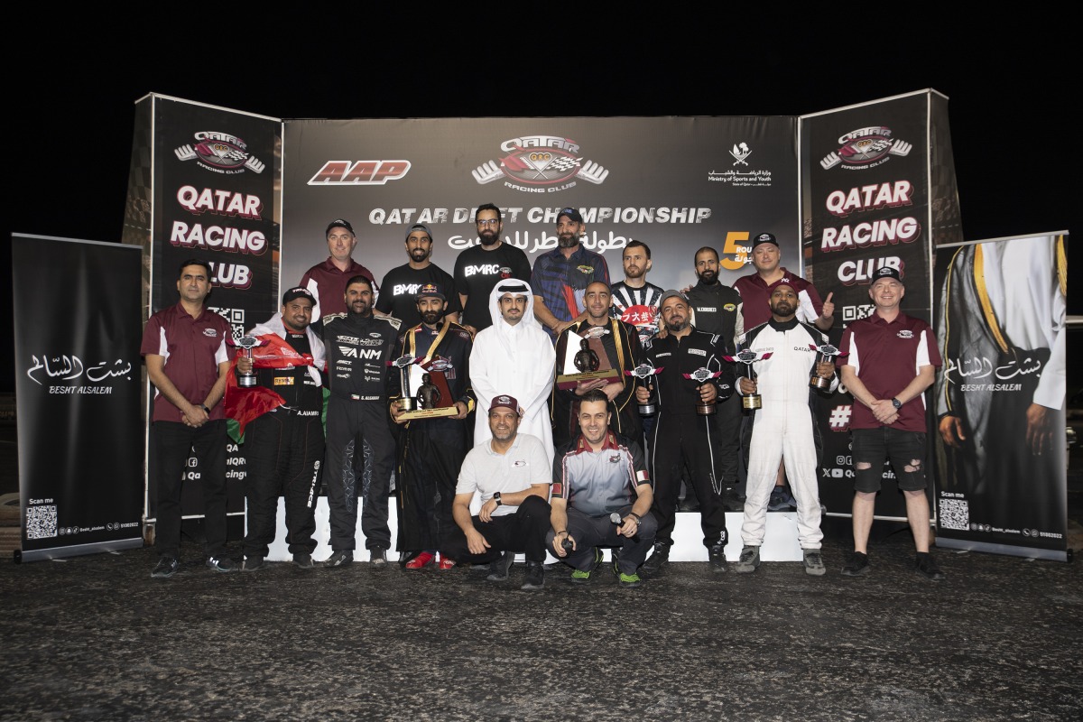 Qatar Racing Club Director General Sheikh Jabor bin Khalid Al Thani poses with the podium winners.