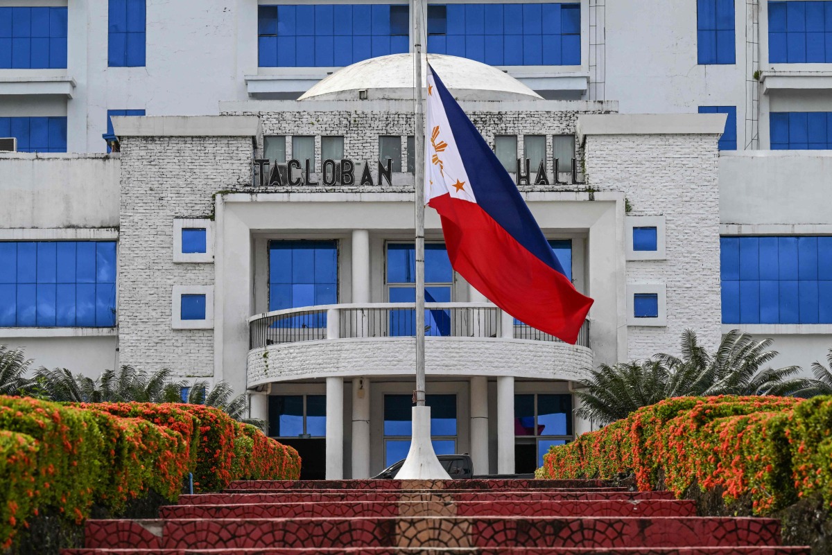 This photo shows the Philippine national flag flying at half-mast at the city hall in Tacloban City, province of Leyte on April 22, 2025, a day after the death of Pope Francis. Photo by Jam STA ROSA / AFP
