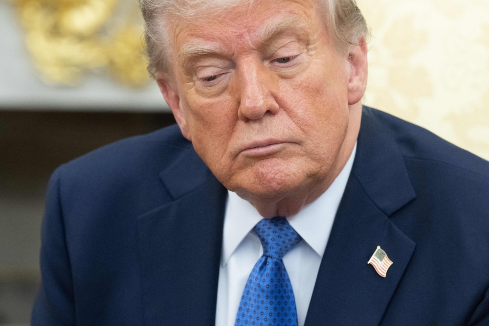 US President Donald Trump looks on during a bilateral meeting with Prime Minister of Norway Jonas Gahr Store in the Oval Office of the White House in Washington, DC, on April 24, 2025. (Photo by Saul Loeb / AFP)