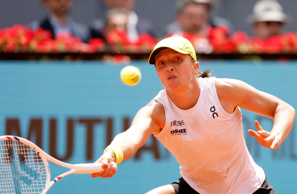 Poland's Iga Swiatek returns the ball to Russia's Diana Shnaider during their 2025 WTA Tour Madrid Open tennis tournament match at the Caja Magica in Madrid, on April 29, 2025. (Photo by Pierre-Philippe Marcou / AFP)
