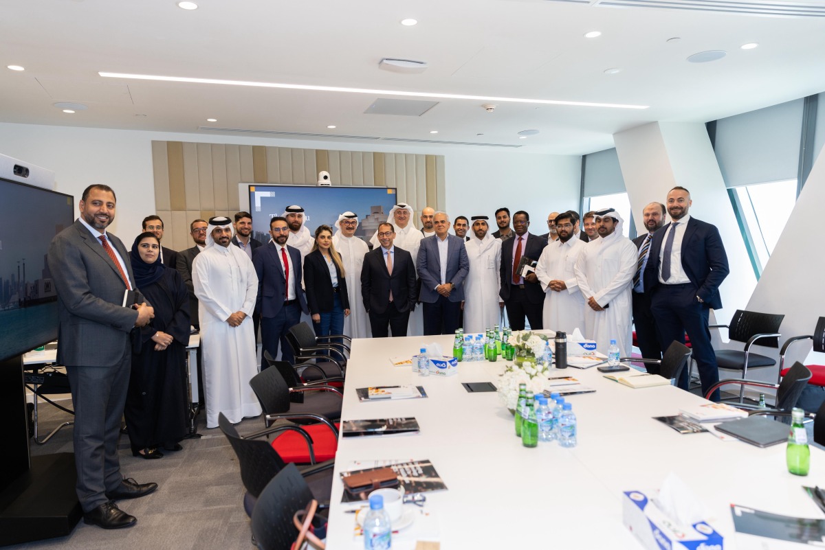 Officials pose for a photo during the session.