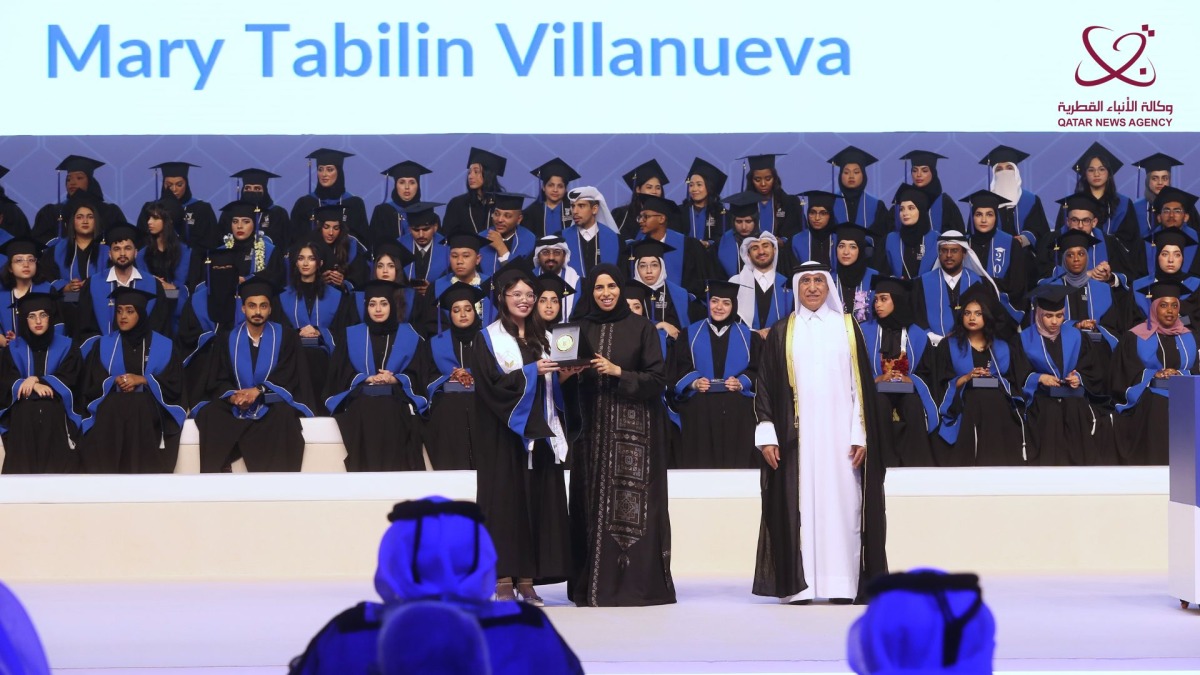 Minister of Education and Higher Education H E Lolwah bint Rashid bin Mohammed Al-Khater honouring an outstanding graduate in the presence of President of UDST Dr. Salem Al-Naemi at a ceremony yesterday.