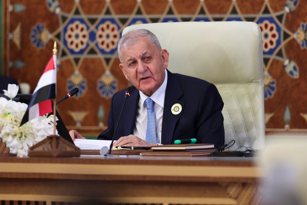 Iraqi President Abdul Latif Rashid addresses the 34th Arab League summit in Baghdad on May 17, 2025. (Photo by Thaier Al-Sudani / Pool / AFP)
 
