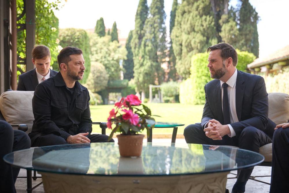 This handout photograph taken and released by Ukrainian Presidential press-service on May 18, 2025 shows President Volodymyr Zelensky and Vice President of the United States JD Vance talking during their meeting in Rome. (Photo by Handout / Ukrainian Presidential press-service/ AFP)
