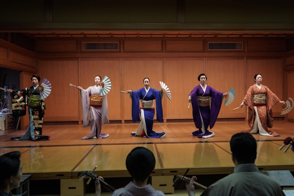 This photo taken on May 8, 2025 shows Shinbashi geishas rehearsing under the watchful eyes of instructors. (Photo by Caroline Gardin / AFP) 